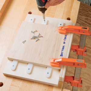 Jig for cutting tool chest door runners